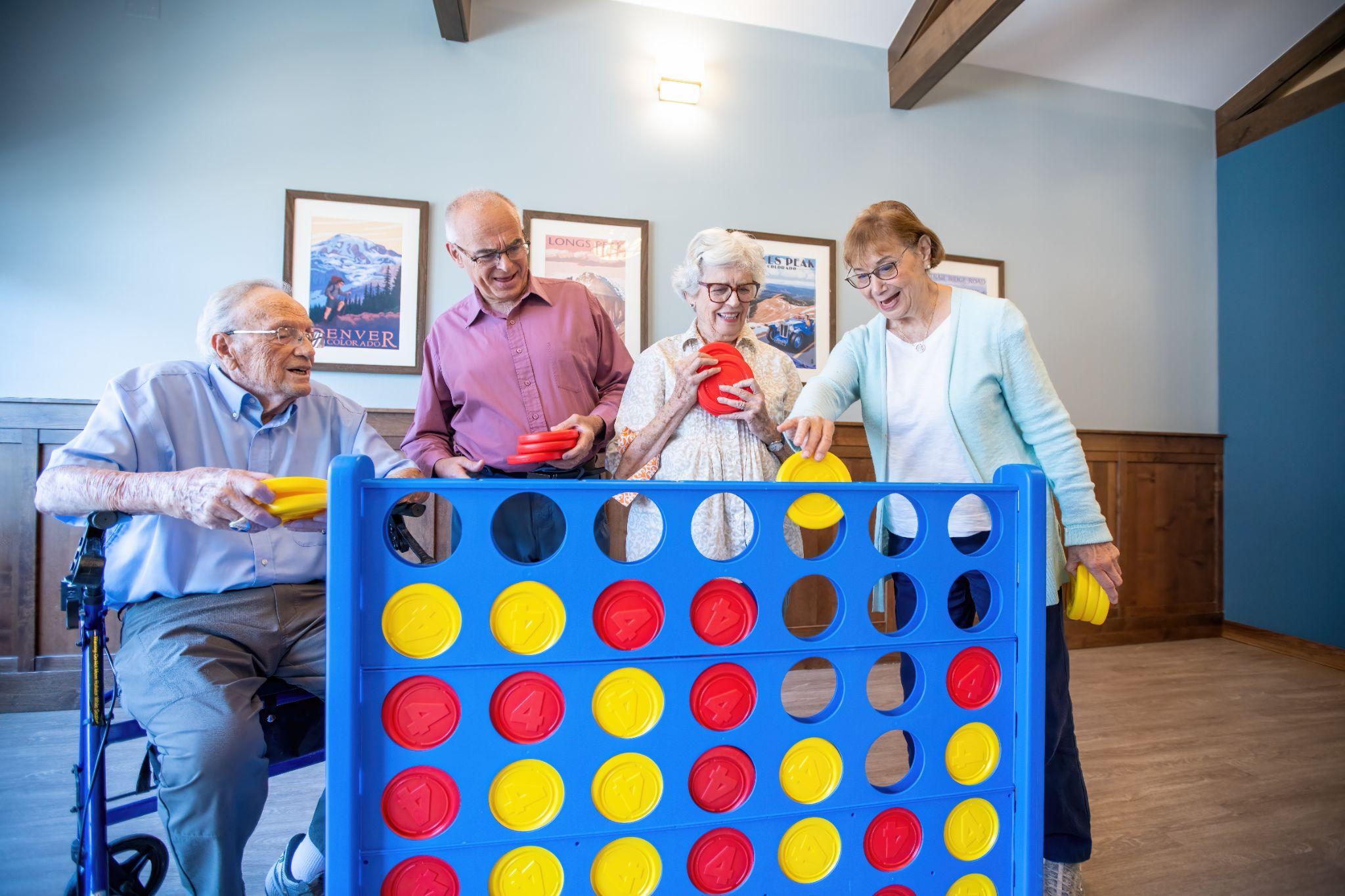 A group of senior residents at High Plains Crossing play a game of giant Connect 4
